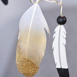 6 golden feathers with glitter